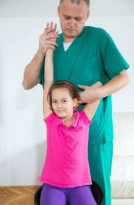 image of a chiropractor doing an adjustment on a young girl